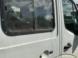 a white van that is parked on the side of the road