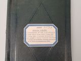 a black book with a blue label on it