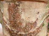a large vase sitting on top of a wooden table
