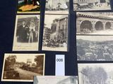 an old photo of a bunch of old photos on a table