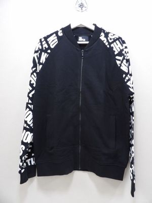 a black jacket with white letters on it hanging on a hanger