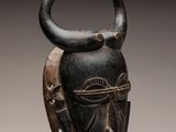 an image of a close up of a mask on a stand