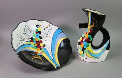 two vases sitting next to each other on a table