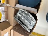 a cardboard box with a bunch of plates inside of it