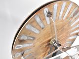 a close up of a clock on a wooden stand