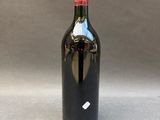 a bottle of wine that is sitting on a table