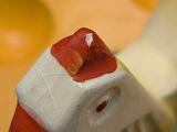 a close up of a cupcake brush with a cupcake in the background