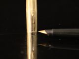 a pen that is sitting on top of a table