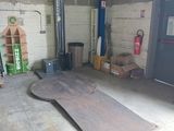 an image of a garage with a lot of stuff in it