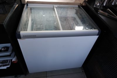 a white refrigerator with a glass door in a kitchen