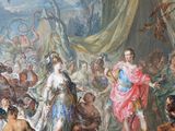 a painting on the wall of a room with a lot of people