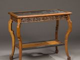 an antique table with a marble top and wooden legs