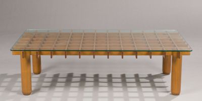 a glass table with wooden legs and a glass top