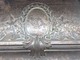 a metal plaque with a picture of a man and a woman on it