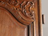 a close up of a wooden door with carvings on it
