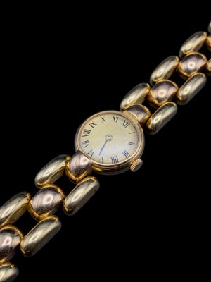 an image of a close up of a wrist watch on a black background