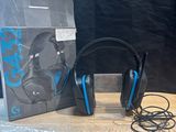 a box with a pair of headphones sitting on a table
