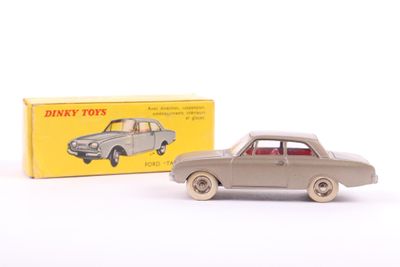 an image of a toy car and box on a white surface