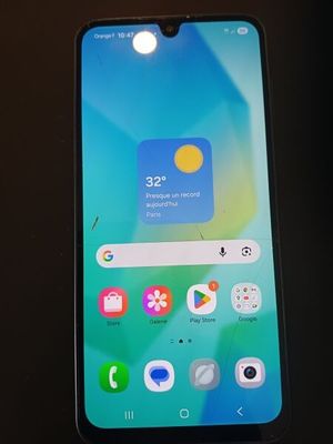 a close up of a cell phone on a table