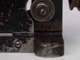 a close up of a metal object on a white surface