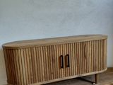 a wooden entertainment center in the corner of a room