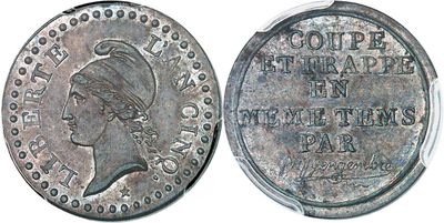 a close up of a coin with a woman ' s head on it