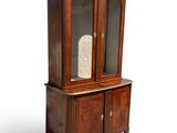 an old wooden cabinet with a glass door and two drawers