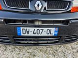 a black car with a blue license plate on it