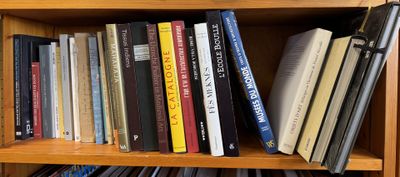 a book shelf with many books on top of it