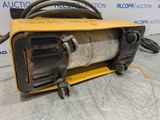 a close up of a machine with a hose attached to it