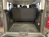 the back of a van with the cargo door open and the seats folded down