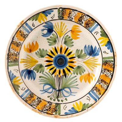 an image of a decorative plate with flowers on it