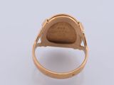 a close up of a gold ring with a stone in the middle