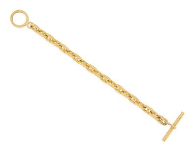 a gold chain bracelet with a cross charm