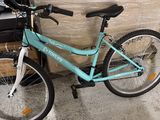 a bike that is sitting next to a box