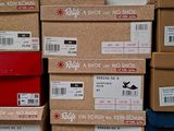 boxes stacked on top of each other on a table in front of a wall