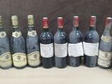 several bottles of wine are lined up on a table