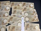 a lot of different bank notes on the table