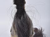 a close up of a wig on a mannequin head