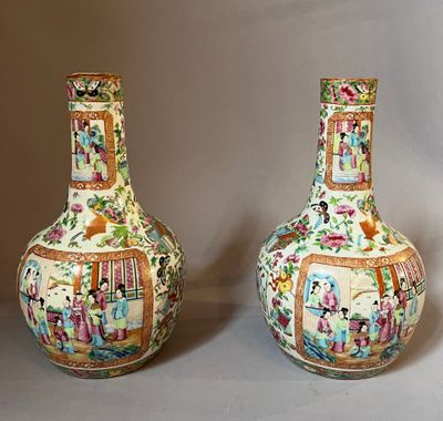 two vases sitting side by side on a table