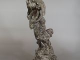 statue of a woman with a goat on her back on a marble base