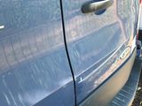 a close up of a car door with a sticker on it