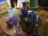 a table that has a lot of glass items on it