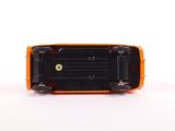 a close up of an orange toy car on a white surface