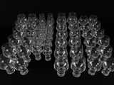 a lot of empty wine glasses sitting on a table
