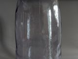 a clear glass jar with a metal lid on a counter