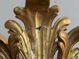 a gold vase that is sitting on a table