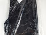 the back of a pair of black pants wrapped in plastic