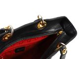 an image of a black purse on a white background