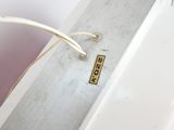 a close up of a white box with a tag on it